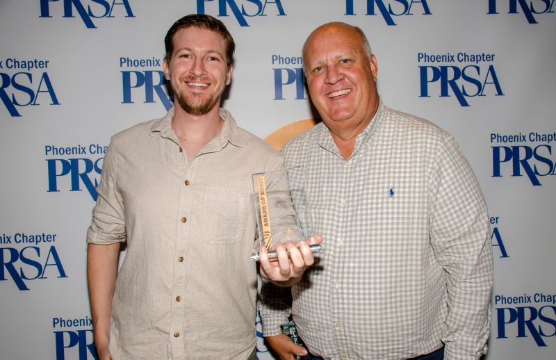 Alex Gambino and Keith Woods accepting award at PRSA Ceremony